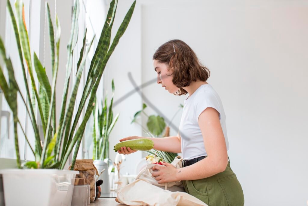 Young woman arranging organic groceries