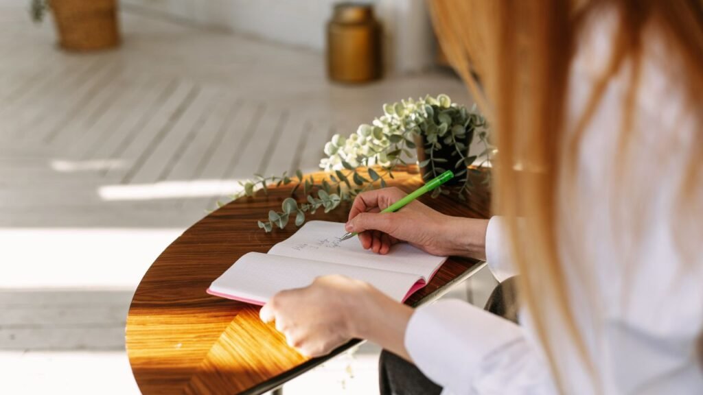 Girl writing her journal